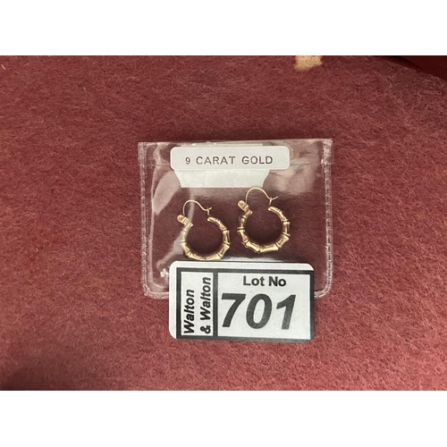 701 - Pair of 9ct gold hinged earrings