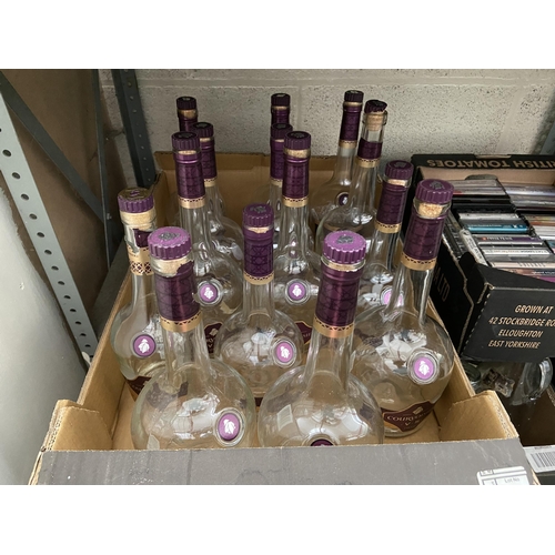 8 - Box containing empty Courvoisier bottles