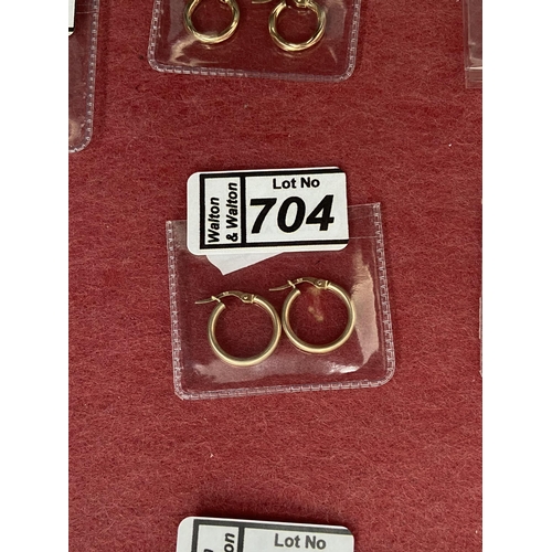 704 - Pair of 9ct gold hinged creole earrings