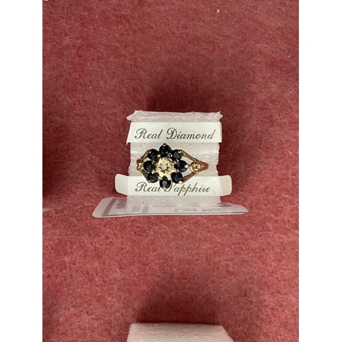 713 - 9ct Gold diamond and sapphire ring