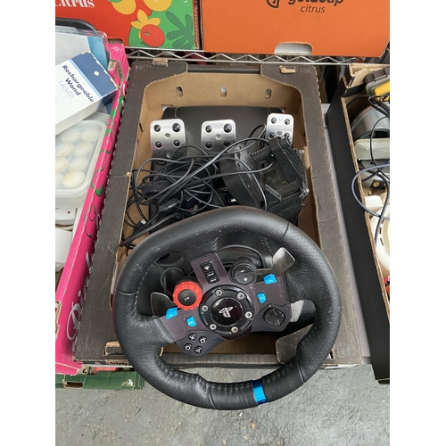 446 - Box containing a Logitech PlayStation steering wheel etc