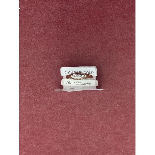 608 - 9ct Gold diamond ring