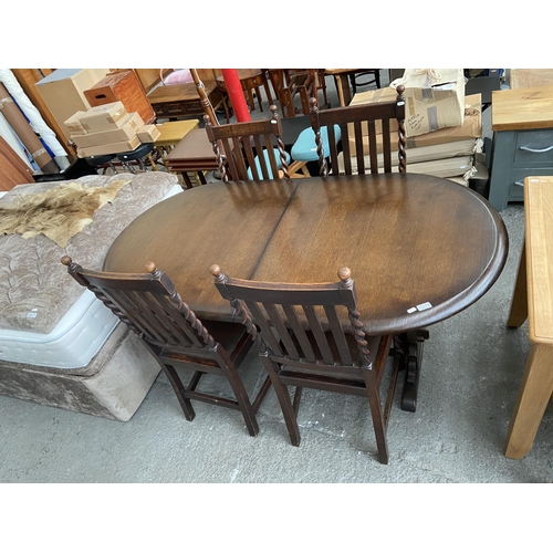 279 - Dark wood extending table and 4 chairs