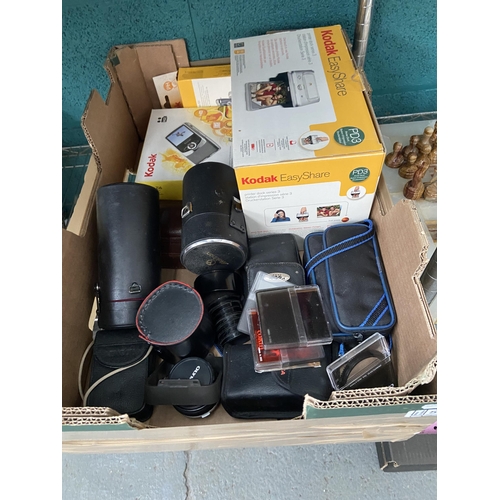 533 - Box containing a camera and lenses etc