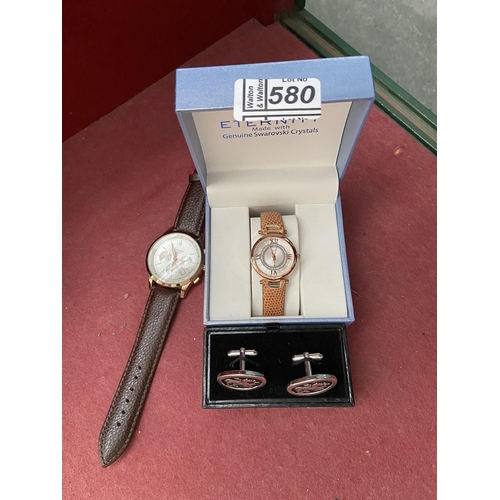 580 - 2 Wristwatches and a set of cuff links