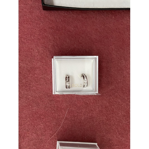 584 - Pair of 9ct white gold earrings