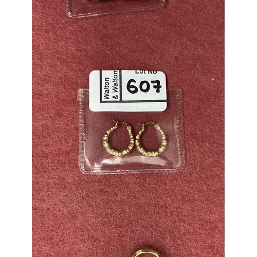 607 - Pair of ornate 9ct gold hinged earrings