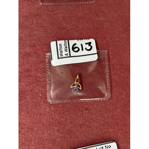 613 - 9ct Gold stone set charm