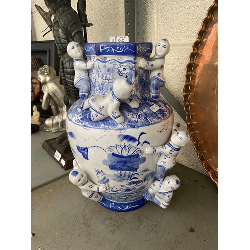 35 - Chinese 'climbing men' vase (one cracked figure)