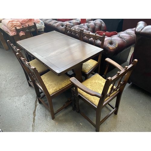 553 - Dining table and 6 Ercol chairs