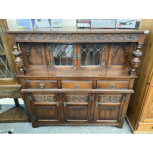 313 - Ornate court cupboard