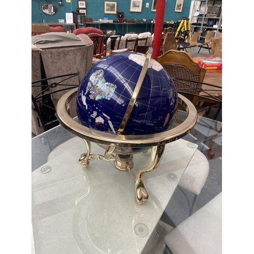 547 - Large rotating globe inlaid with semi precious stones