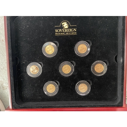 1014 - Display case containing 7 full sovereigns (1871, 1895, 1910, 1915, 1928, 1957 & 2006) - Only 10% buy... 