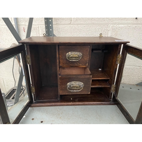 2 - Small glazed collector's cabinet