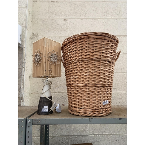 55 - Wicker laundry basket and a modern lamp