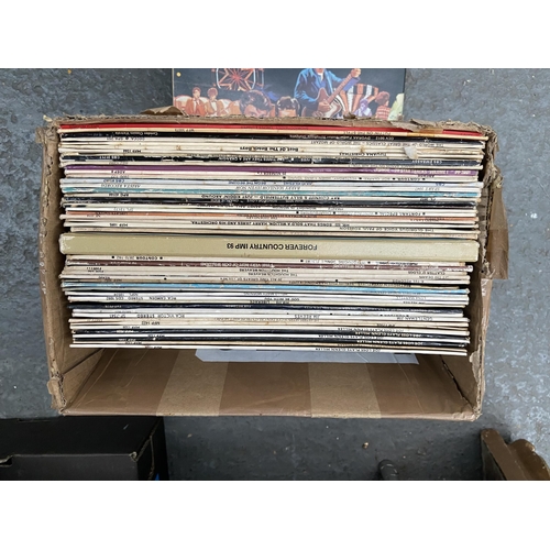 116 - 4 Boxes containing DVDs and LPs