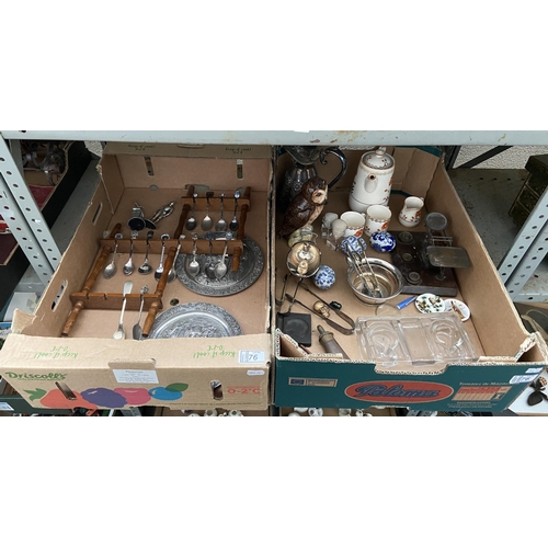 76 - 2 Boxes containing collectible spoons, scales, powder flask and curios