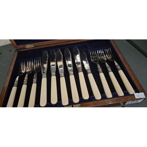 18 - Canteen of silver collared fish cutlery