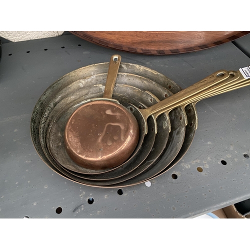 34 - Brass handled copper pan set