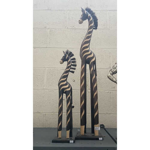 12 - Pair of large zebra carvings