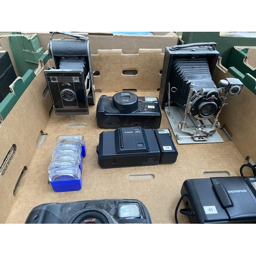 592 - Box containing vintage cameras including Canon, Pentax etc and 6 Voightlander filters