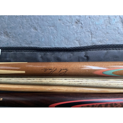 694 - 2 Snooker cues, hand signed by Steve Davis and Paul Hunter