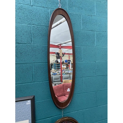 713 - Large oval wooden framed mirror