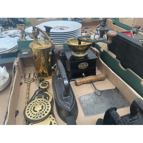 84 - Box containing flat irons, horse brasses, cast iron coffee grinder etc