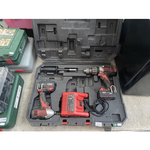 301 - 2 Milwaukee drills with batteries and chargers (working)