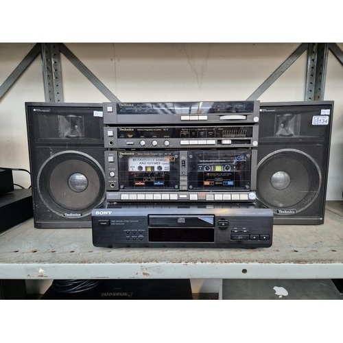 134 - Sony CD player (CDP-M205) and a set of Technics separates with speakers.