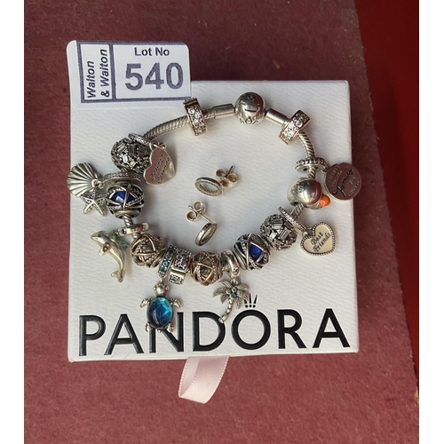 540 - Pandora bracelet with several charms and earrings