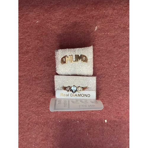 565 - 9ct gold 'mum' ring and a stone set ring - Only 10% buyer's premium