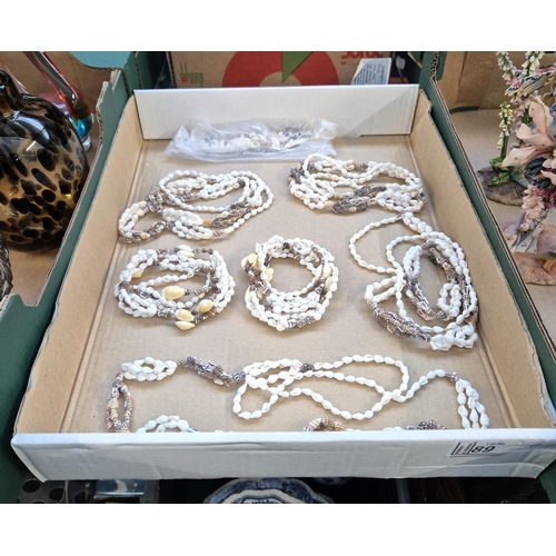 89 - Box containing shell necklaces