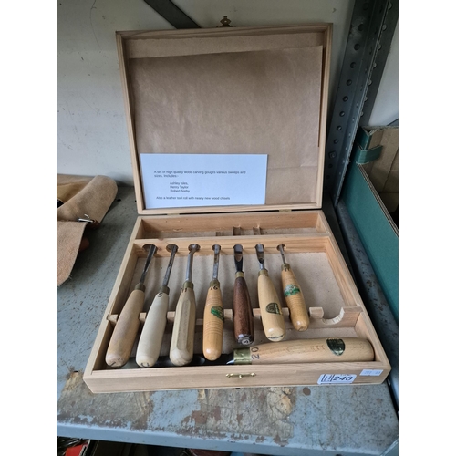 240 - Box containing a leather tool roll containing chisels, and assorted wood carving gouges