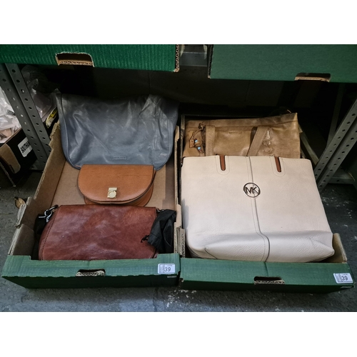 39 - 2 Boxes containing handbags including Lloyd Baker