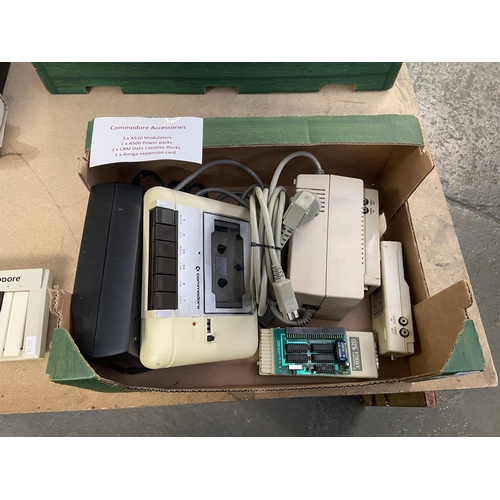 521 - Box containing Commodore accessories including modulators, power packs etc