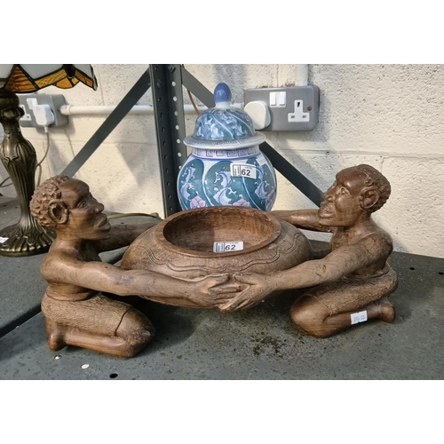 62 - African carved bowl and an ornate jar