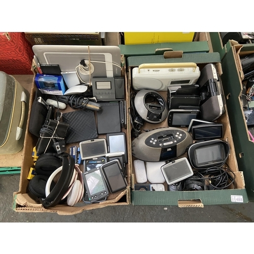 488 - 2 Boxes containing a Roberts radio, assorted Sat Navs, Collins spellchecker, headphones etc