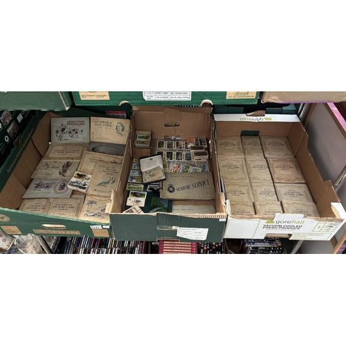 142 - 3 Boxes containing vintage cigarette card sets including footballers, film stars and trains