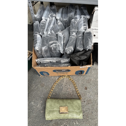150 - Box containing a quantity of new ladies purses and dust bags