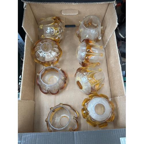284 - Box containing 8 amber art glass light shades