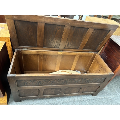 392 - Ornately carved vintage bedding box