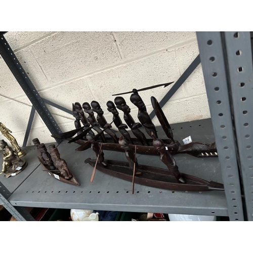 18 - A trio of 3 African carved long boats