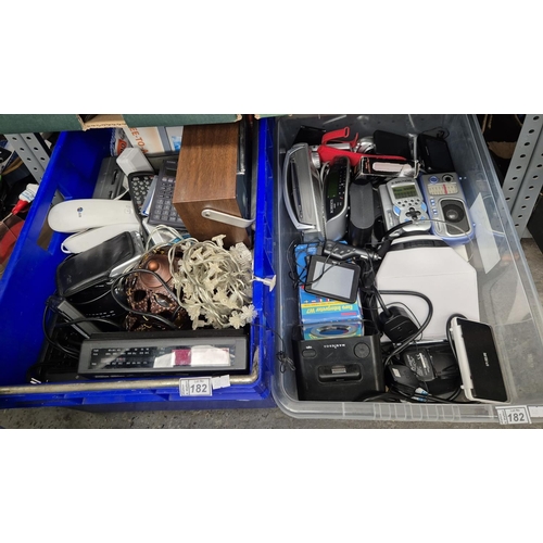 182 - 2 Boxes containing electronics including calculators, radios, sat-navs etc