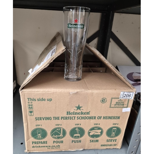 206 - Box containing 24 new, half pint Heineken glasses