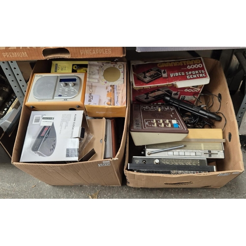 214 - 2 Boxes containing electronics including assorted radios and Sony speakers etc