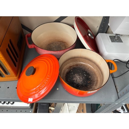 202 - Le Creuset and Pyrex cast iron casserole dishes