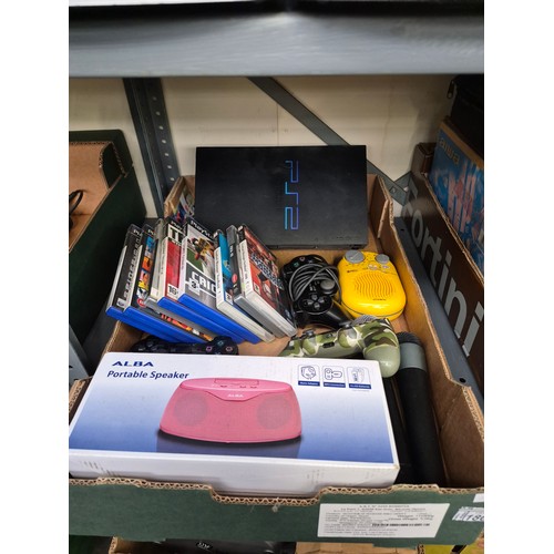 186 - Box containing a PlayStation 2 console, controllers and games, microphones etc