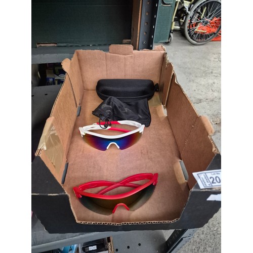 204 - Box containing 2 pairs of sunglasses