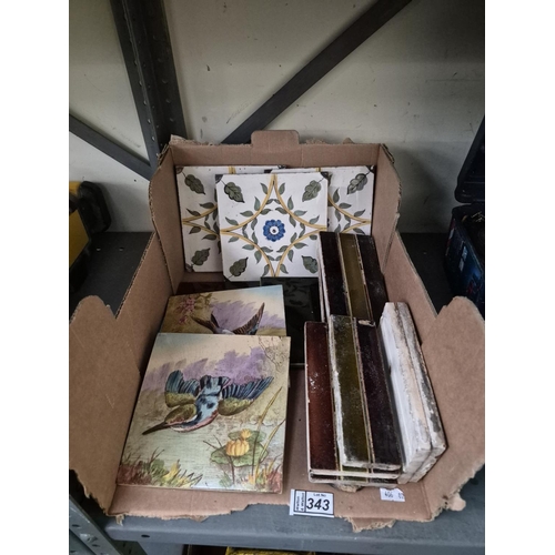 Box containing a quantity of assorted tiles